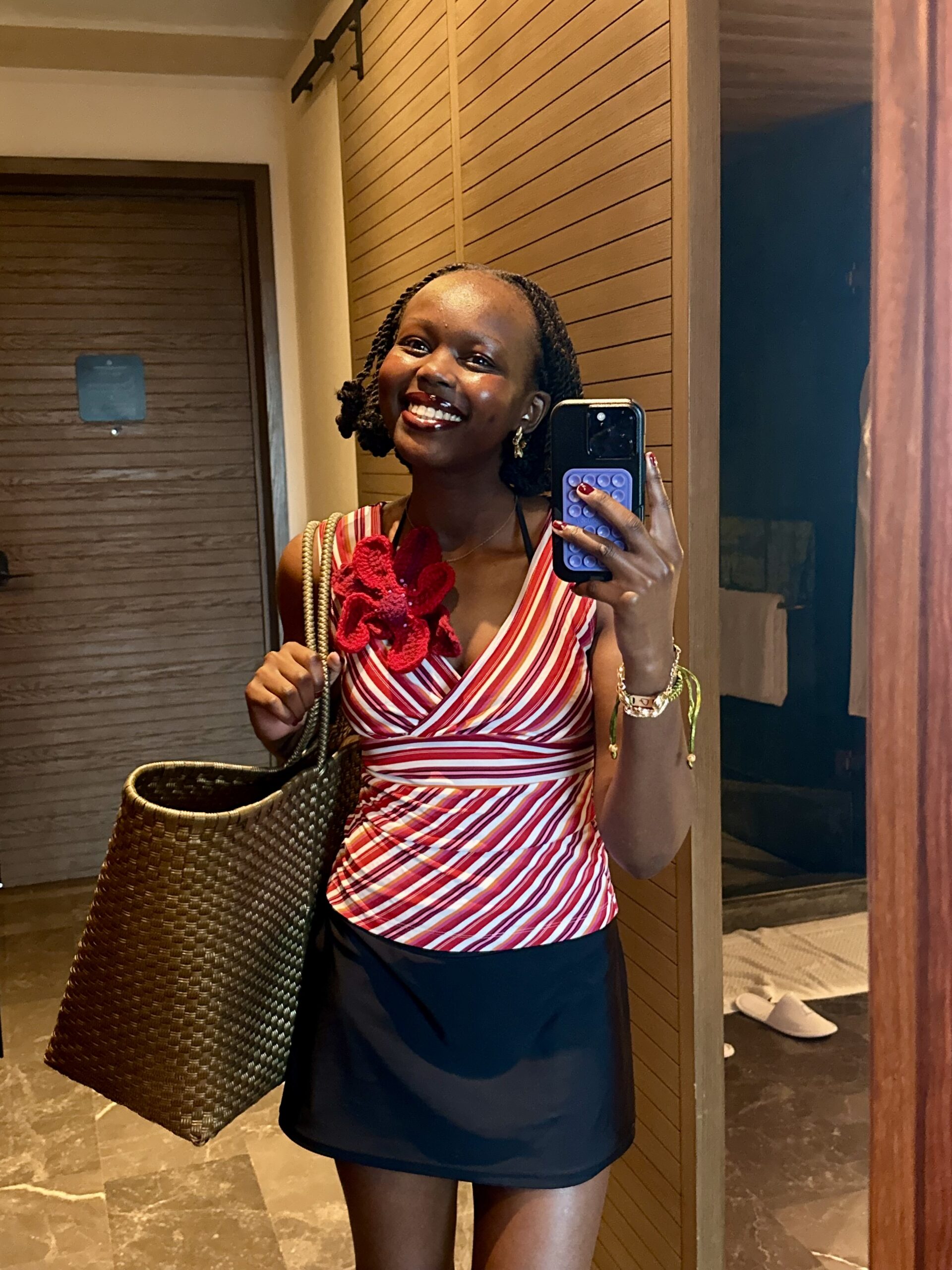 Author smiling with beach bag in hand