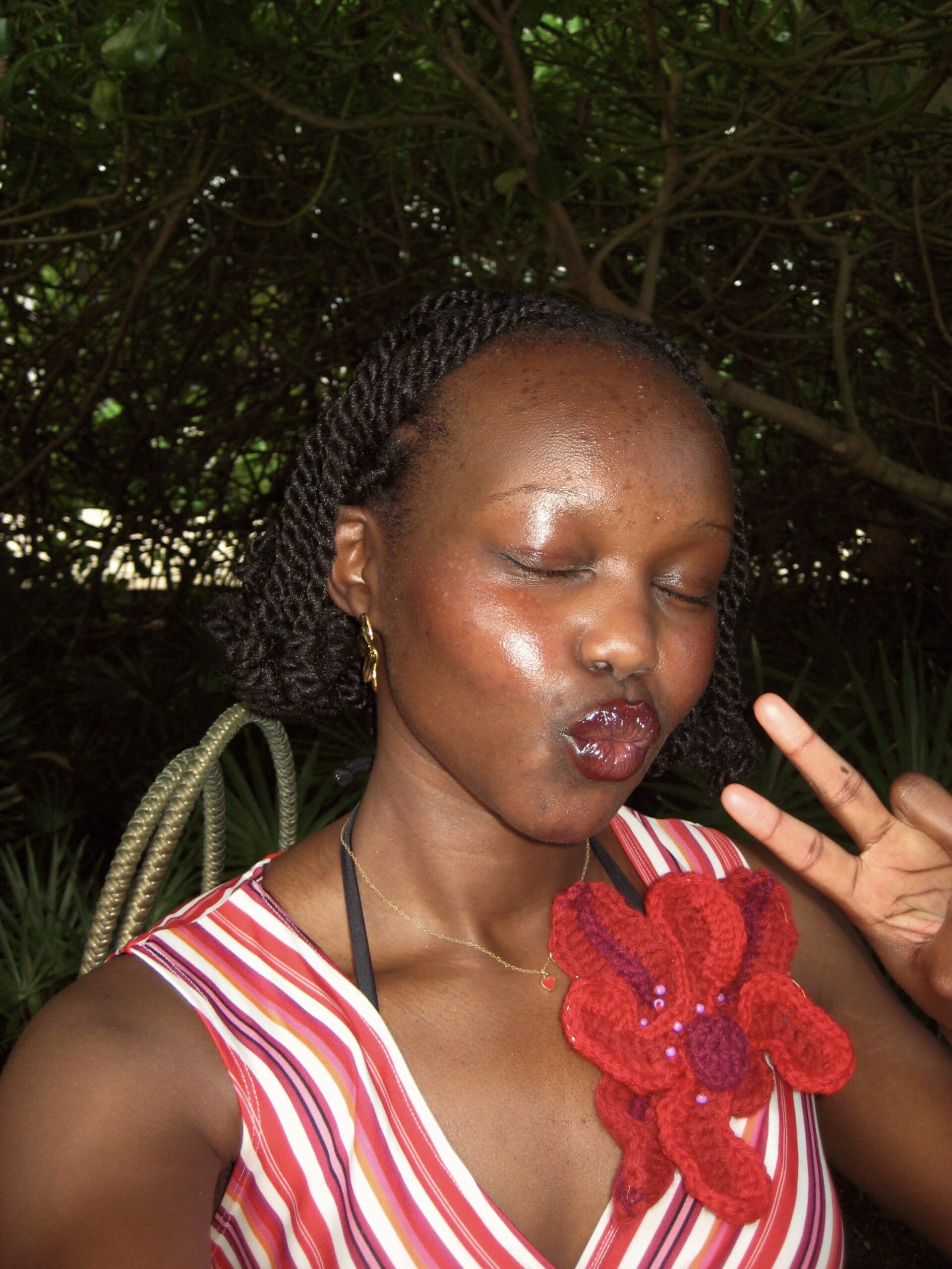 Author doing peace sign and kissy-face