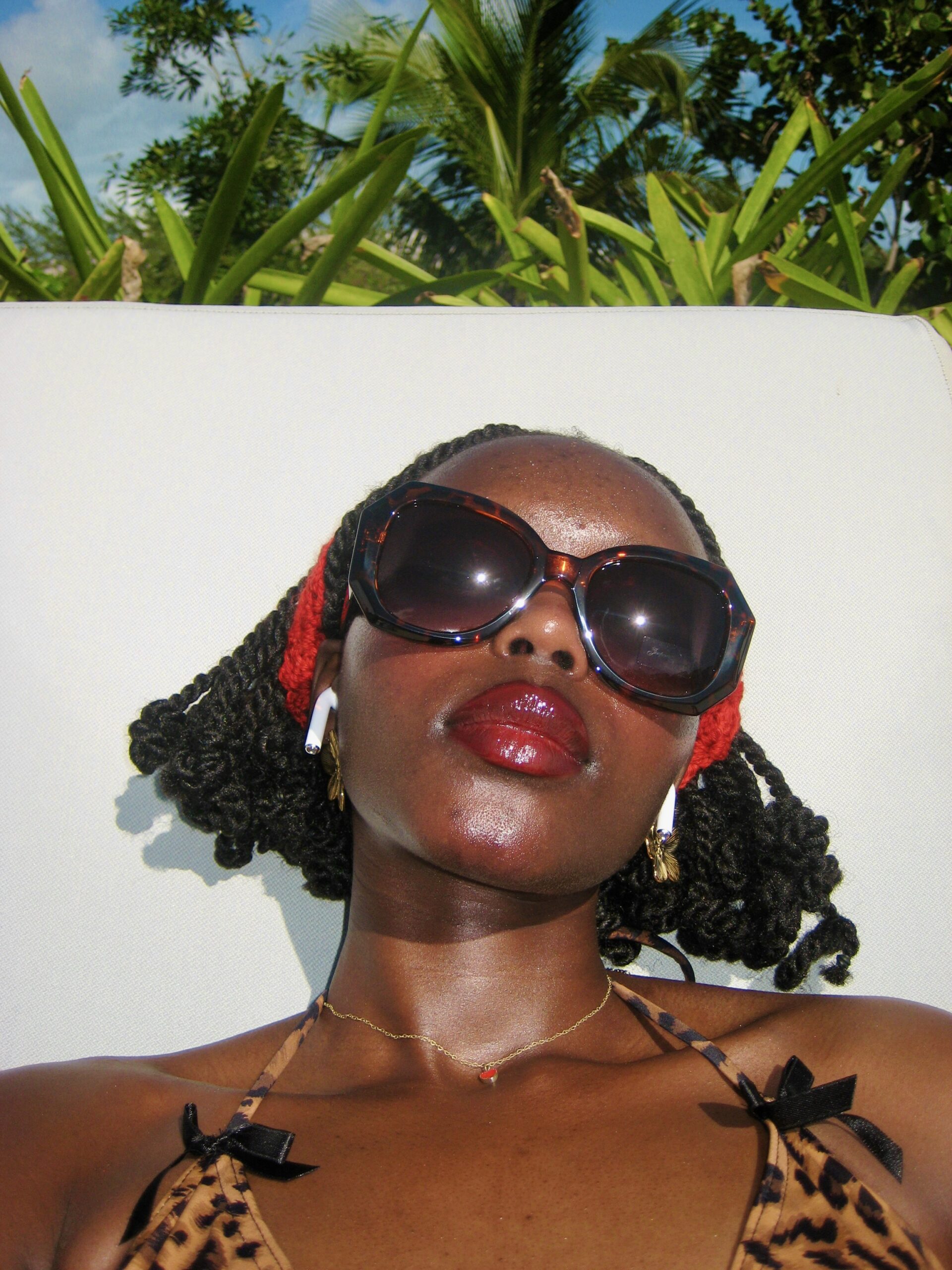 Selfie lounging on pool chair