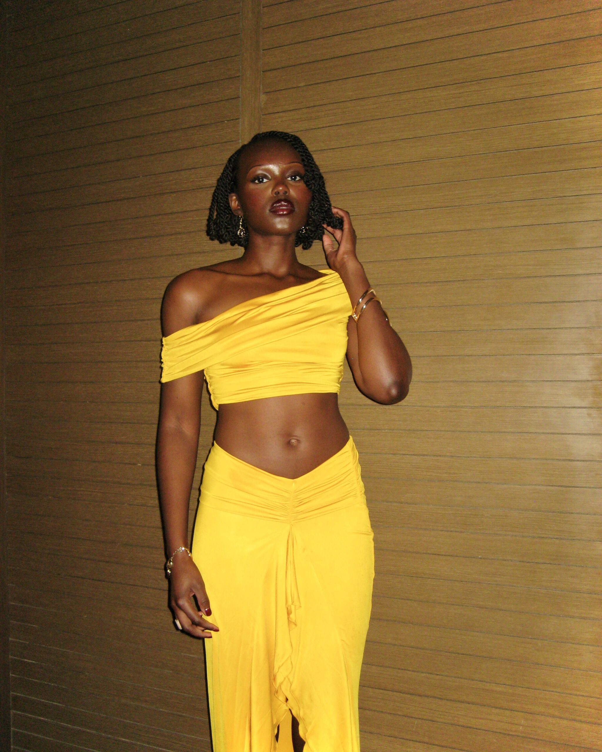 Author posing in yellow two-piece