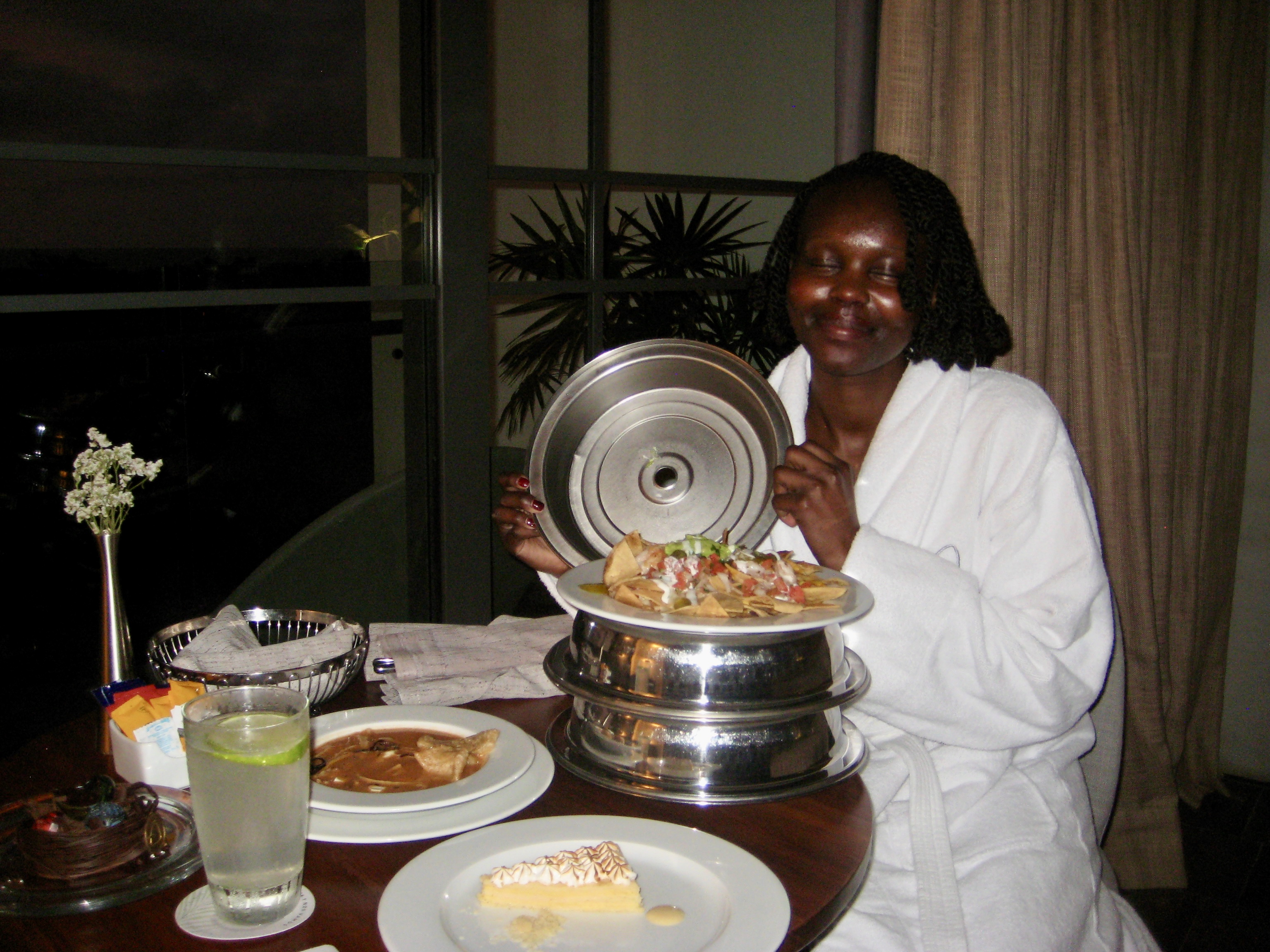 Author smiling with room service food