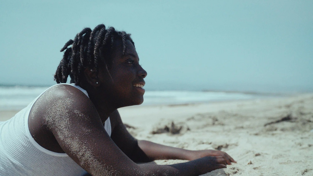 boy at the beach smiling